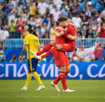 John Guidetti of Sweden look dejected while Harry Maguire