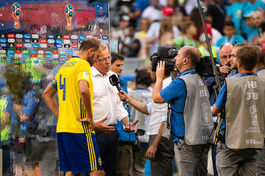 Andreas Granqvist and head coach Janne Andersson of Sweden