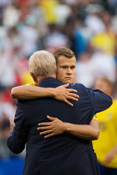 Team Manager Lars Richt of Sweden hugs Viktor Claesson
