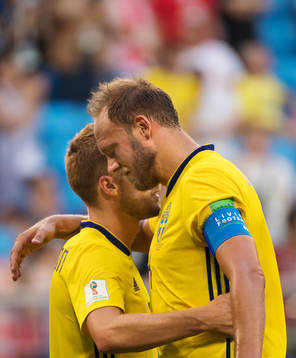 Sebastian Larsson and Andreas Granqvist hug each other