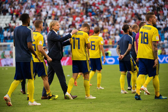 Assistant Team Manager Stefan Pettersson of Sweden comforts