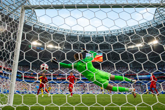 Goalkeeper Jordan Pickford of England saves a shot from