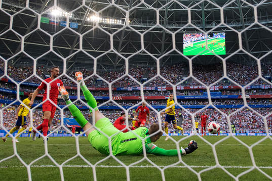 Goalkeeper Jordan Pickford of England saves a shot from