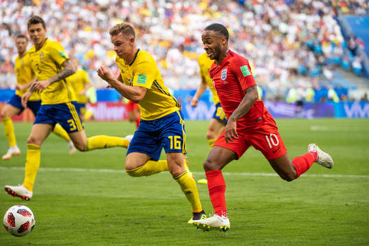 Emil Krafth of Sweden and Raheem Sterling of England