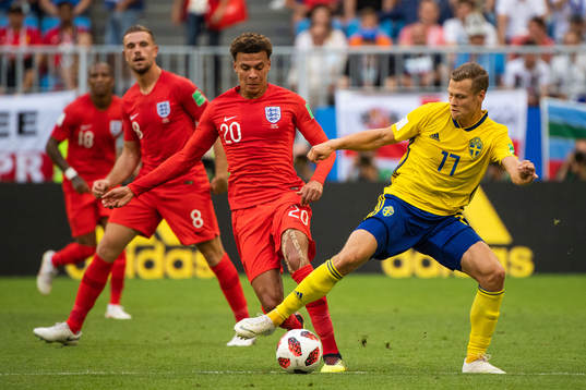 Dele Alli of England and Viktor Claesson of Sweden
