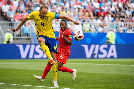 Andreas Granqvist of Sweden and Raheem Sterling of England
