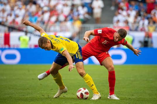 Viktor Claesson of Sweden and Jordan Henderson of England