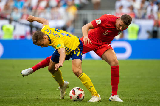 Viktor Claesson of Sweden and Jordan Henderson of England