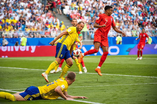 Andreas Granqvist of Sweden and Jesse Lingard of England