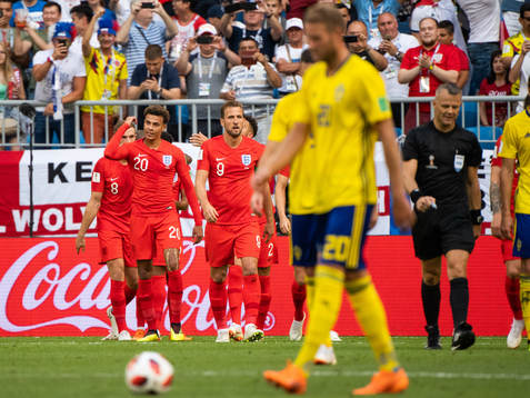 Dele Alli of England celebrates with team mates
