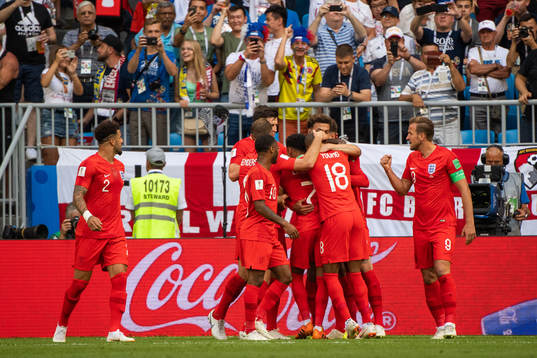 Dele Alli of England celebrates with team mates