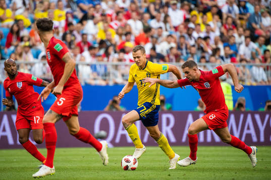 Viktor Claesson of Sweden and Jordan Henderson of England