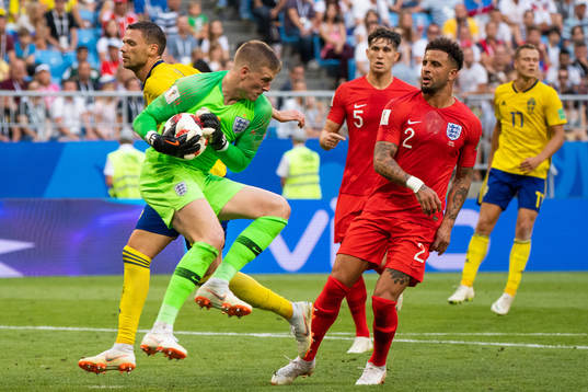 Marcus Berg of Sweden uses his arm against goalkeeper