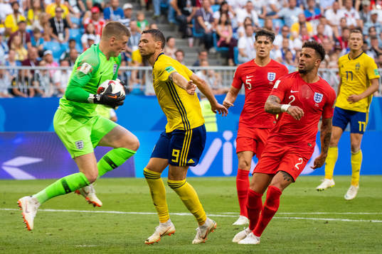 Marcus Berg of Sweden uses his arm against goalkeeper