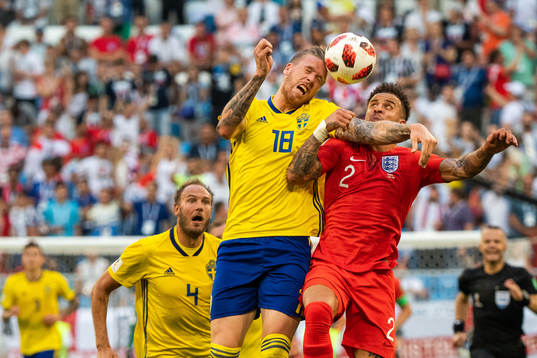 Pontus Jansson of Sweden competes for the ballwith Kyle