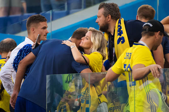Andreas Granqvist of Sweden gets a hug from Tina Larsson,
