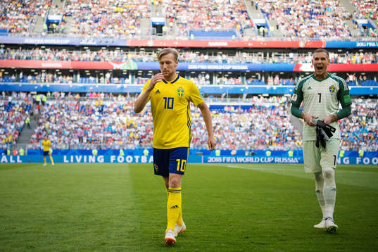 Emil Forsberg and goalkeeper Robin Olsen of Sweden