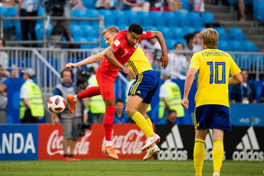 Jesse Lingard of England and Sebastian Larsson of Sweden