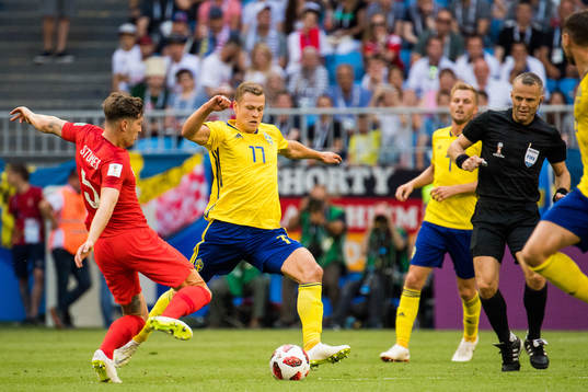 John Stones of England and Viktor Claesson of Sweden