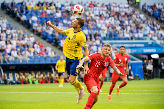 Marcus Berg of Sweden and Kieran Trippier of England
