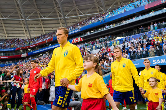 Ludwig Augustinsson and John Guidetti of Sweden enter the