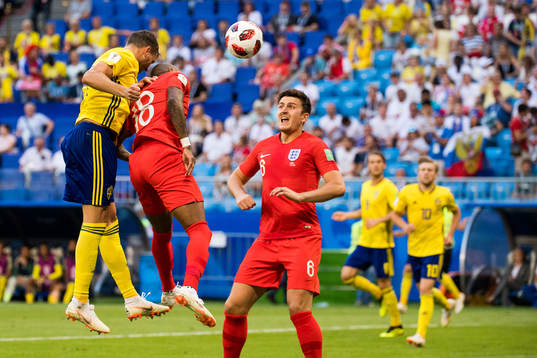 Marcus Berg of Sweden and Ashley Young of England