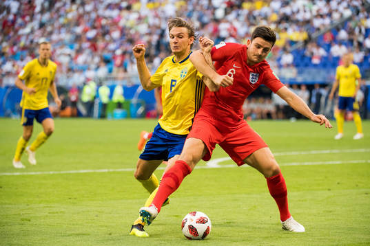 Albin Ekdal of Sweden and Harry Maguire of England