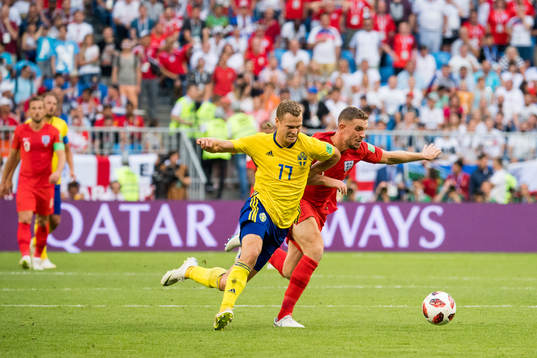 Viktor Claesson of Sweden and Jordan Henderson of England