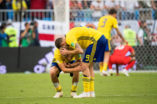 Sebastian Larsson and Marcus Berg of Sweden look dejected