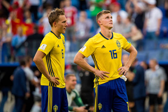 Ludwig Augustinsson and Emil Krafth of Sweden look dejected