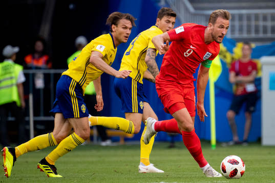 Harry Kane of England and Albin Ekdal of Sweden