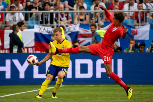 Emil Krafth of Sweden and Dele Alli of England