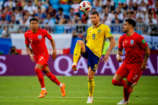 Kyle Walker of England, Marcus Berg of Sweden and Kyle