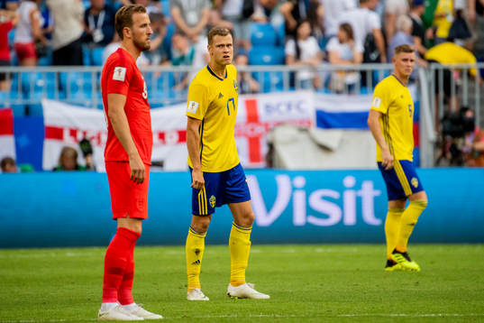 Harry Kane of England and Viktor Claesson of Sweden