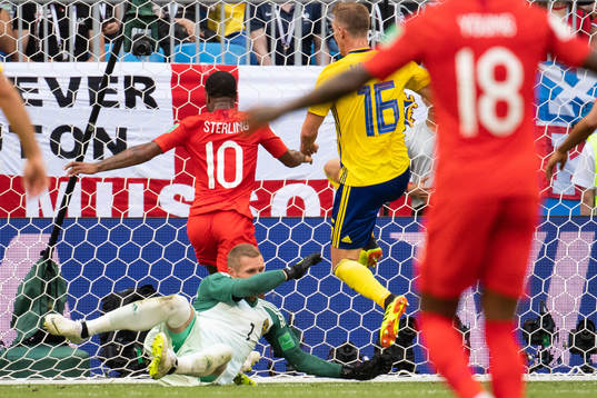 goalkeeper Robin Olsen of Sweden saves a chance from Raheem