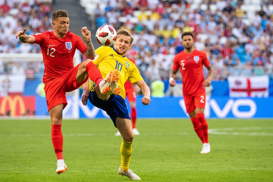 Kieran Trippier of England and Emil Forsberg of Sweden