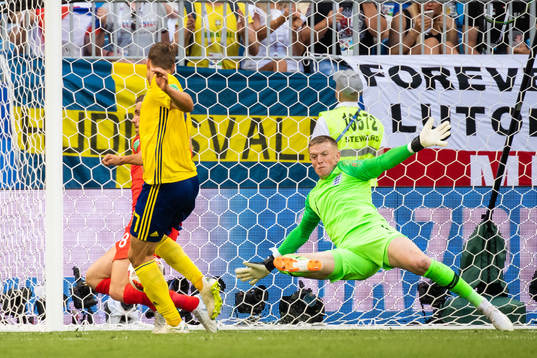 goalkeeper Jordan Pickford of England saves an attempt from