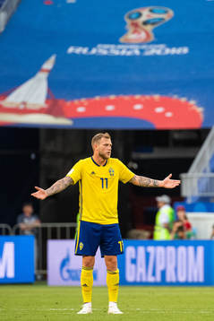 John Guidetti of Sweden reacts