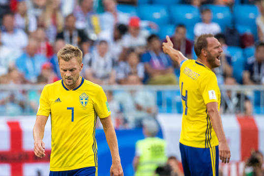 Sebastian Larsson of Sweden looks dejected