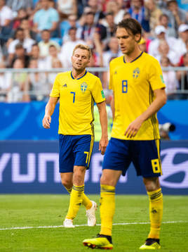 Sebastian Larsson and Albin Ekdal of Sweden looks dejected
