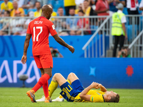 Fabian Delph of England approaches Viktor Claesson of
