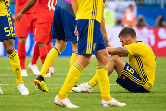 Marcus Berg of Sweden sits down and looks dejected