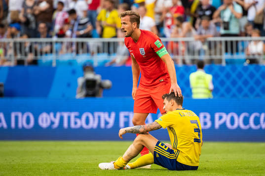 Harry Kane of England approaches Victor Nilsson Lindelöf
