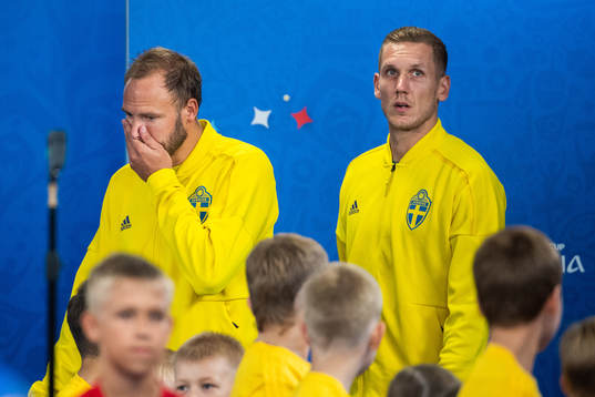 Andreas Granqvist and goalkeeper Robin Olsen of Sweden