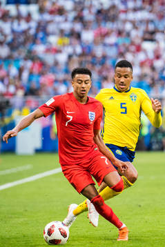 Jesse Lingard of England and Martin Olsson of Sweden