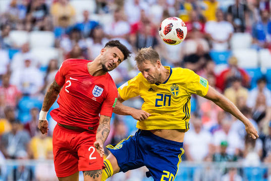 Kyle Walker of England and Ola Toivonen of Sweden