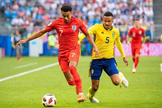 Jesse Lingard of England and Martin Olsson of Sweden