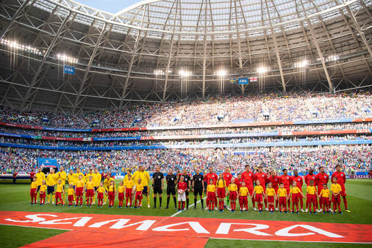 Players of England and of Sweden line up prior to the FIFA
