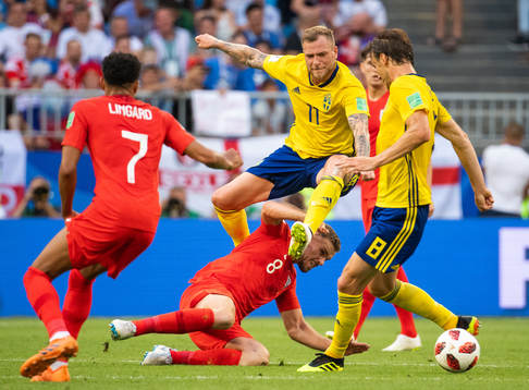 Jordan Henderson of England and John Guidetti of Sweden