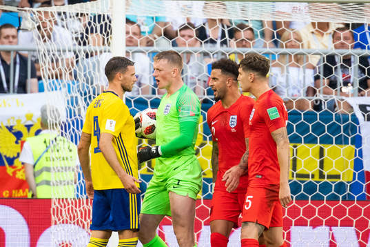 goalkeeper Jordan Pickford of England and Marcus Berg of
